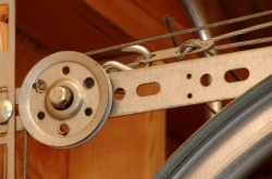 Extension spring system pulley and cable