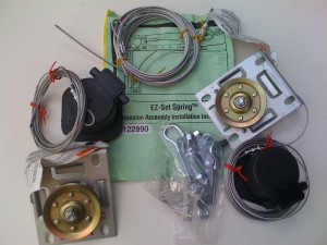 The contents of an EZ-SET winding kit used to wind garage door springs.