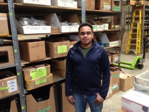 An image of Neal Secker, warehouse manager, working hard in the warehouse.