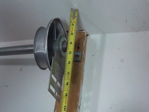 A tape measure showing that there are four inches to the shaft.