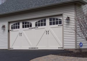 An image of white carriage house doors.
