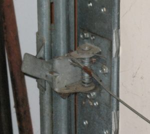An image showing how the garage door striker and latch align. 
