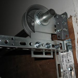 A support bracket shown supporting the anchor bracket above the header.