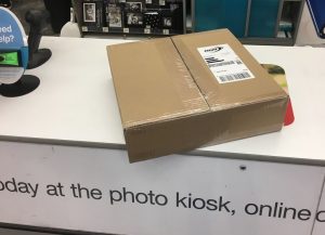 A package laying on a counter at a Walgreens.