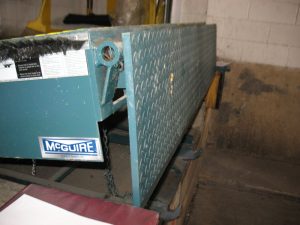 The side view of a Mcguire dock leveler.