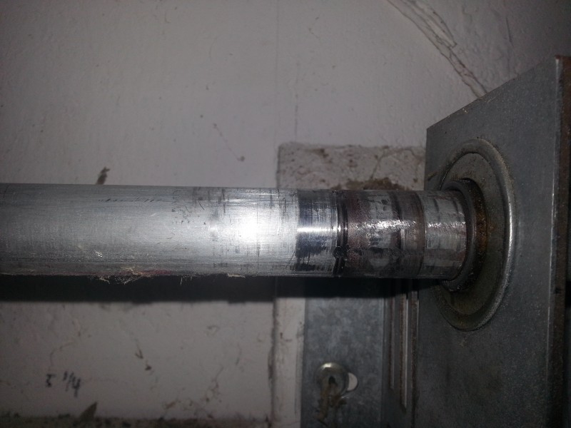 A leaning end bearing plate causing the end of the shaft to wear