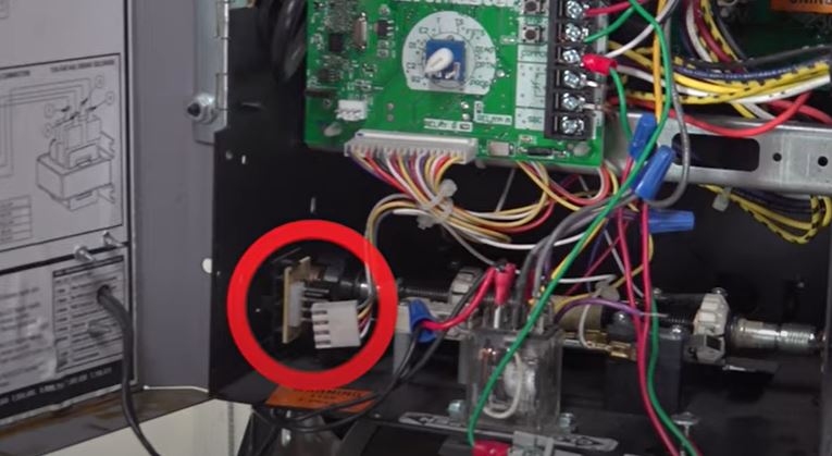 A closure view of RPM sensor in a LiftMaster commercial door operator.