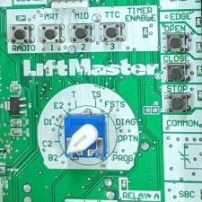The switch at the center of a LiftMaster control board