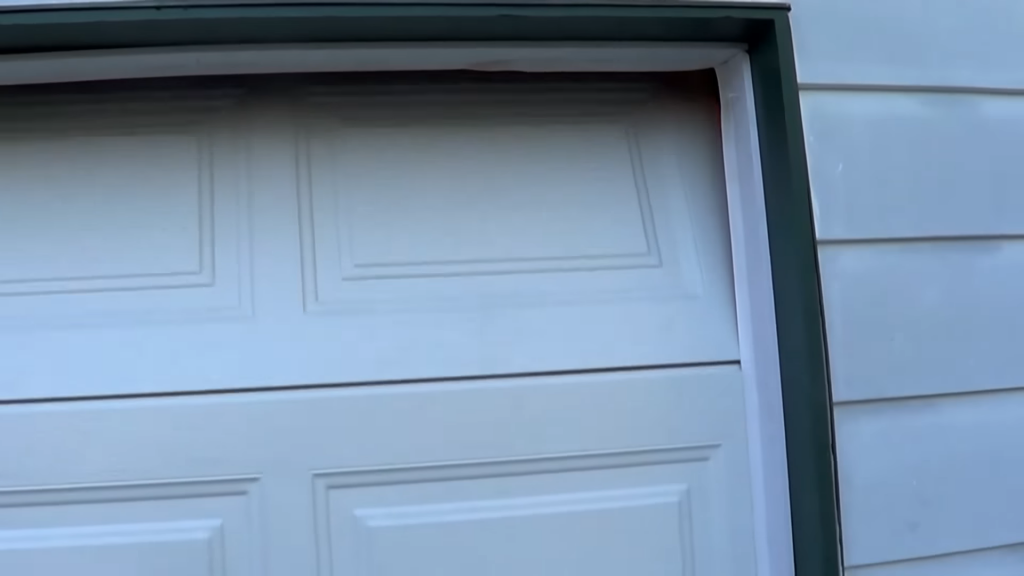 The flaps should be on the outside of the door, with the top flap behind the side flaps so that the door pushes them all outward as it closes.