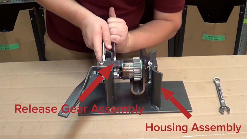 Separating the release gear assembly from the housing assembly