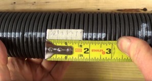 Using Masking Tape to Measure the Width of Ten Torsion Spring Coils
