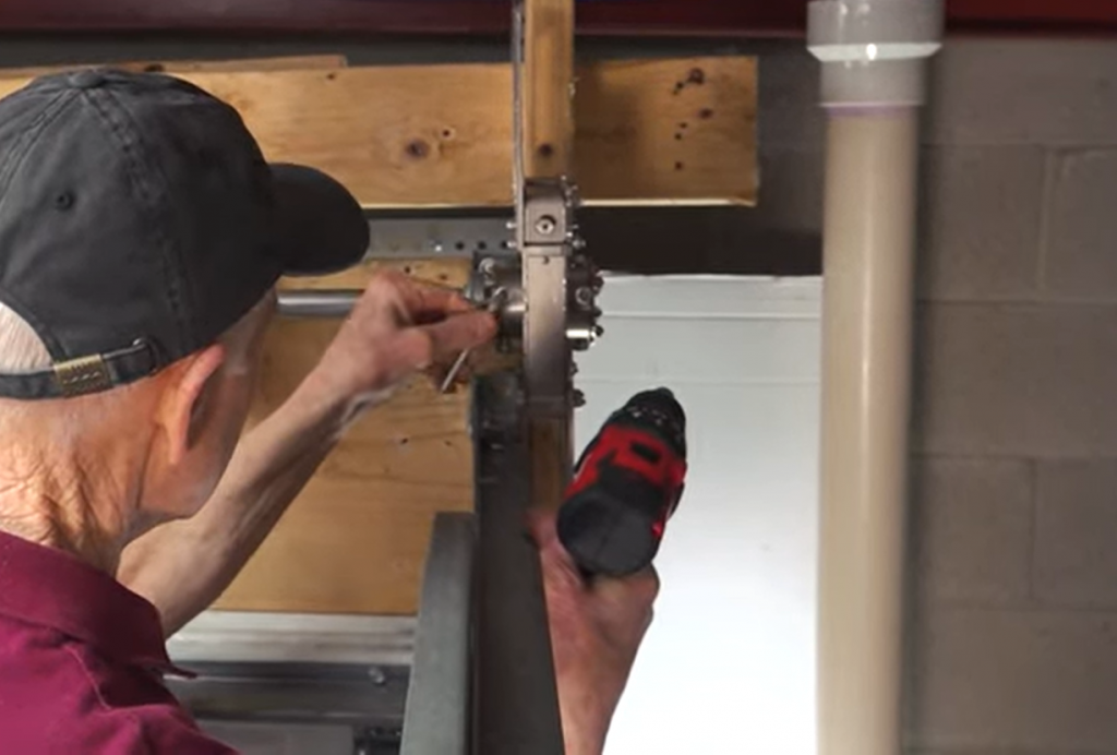 Using a hex key to tighten the set screws on the Safe-T-Winder™