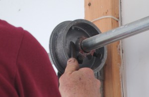 Never use screw drivers to unwind or wind garage door torsion springs.