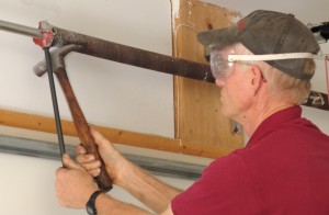 How to loosen cones when doing DIY home repair on garage door torsion springs.