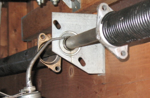 Lube anchor bracket above center of garage door.