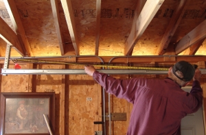 Measure the length of the extension springs.