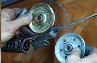Garage Door Repair: Replacing worn pulleys.