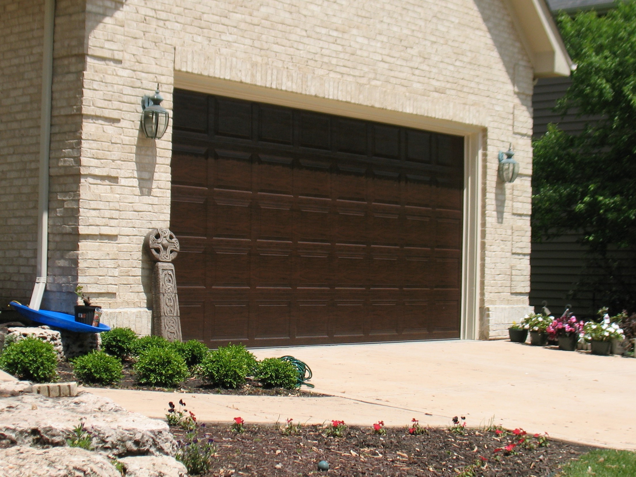 An image of a brown panel garage door.