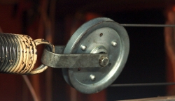 The end of the extension spring is attached to a pulley