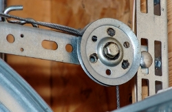 Replace worn pulleys when you change your old extension springs